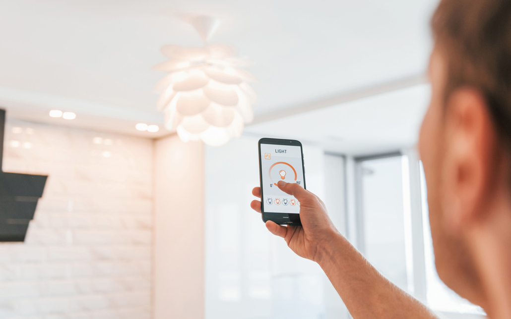 Man Controlling Light With Phone