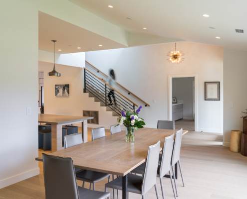 Modern Kitchen Dining Living Space, Woman On Stairs